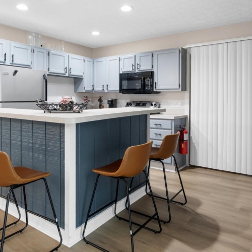 a community kitchen with chairs