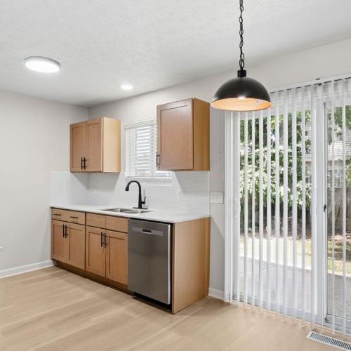 spacious kitchen with sliding door access to back yard
